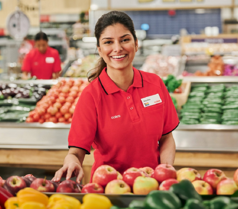 Coles team member with fresh produce