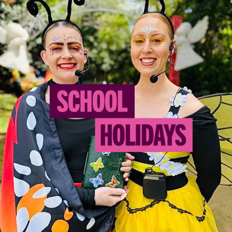 Miss Butterfly and Miss Bee. Text 'School Holidays'