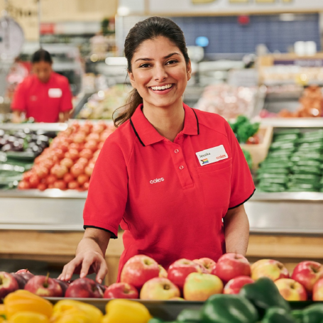 Coles team member with fresh produce